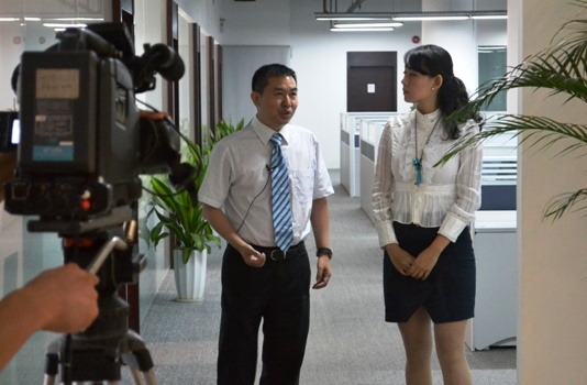 深圳电视台到菠菜担保网集团采访